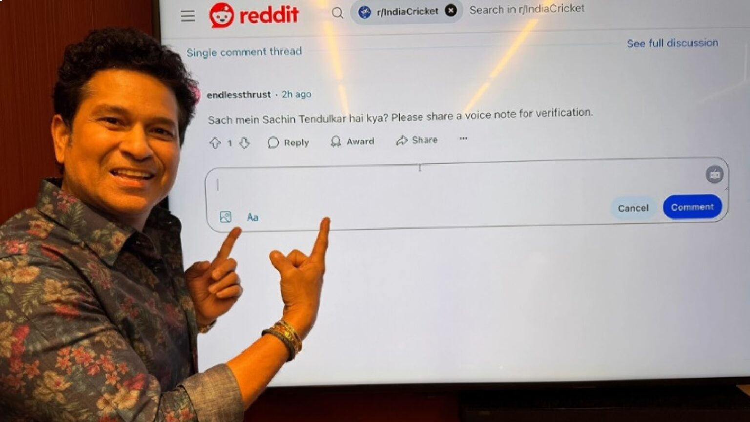Sachin Tendulkar pointing at a fan
