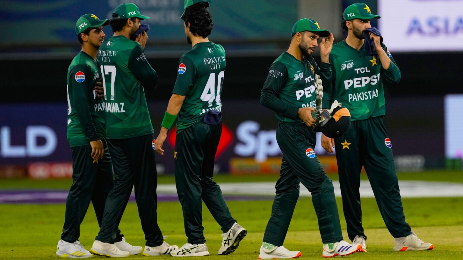 Pakistan players react after their loss in the Asia Cup cricket match against India at Dubai International Cricket Stadium in Dubai, United Arab Emirates, Sunday, Sept. 14, 2025. (AP Photo)